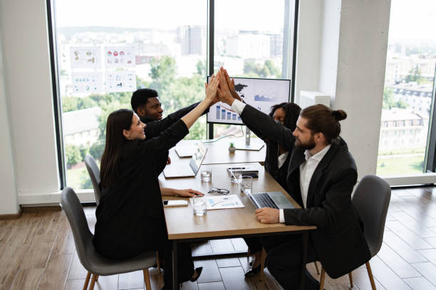 istock Business team celebrating successful project in modern office 2158049638