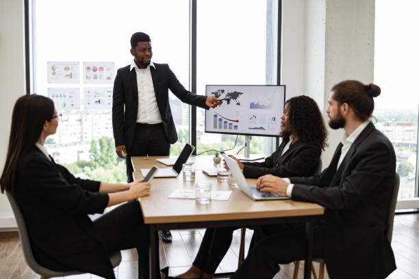 istock Business team meeting in modern office discussing data and strategy 2158049694
