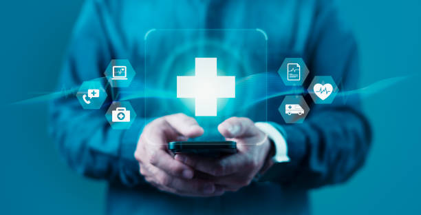 istock A man is holding a cell phone with a blue screen that has a medical symbol 2158049978
