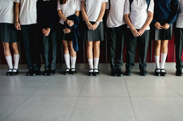 Group of students standing in the row