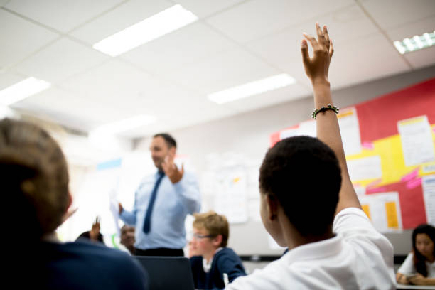 istock Student with her hand up in responding to the teacher 2158050637