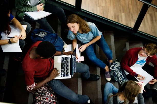 istock A group of students studying on the stairs 2158050996