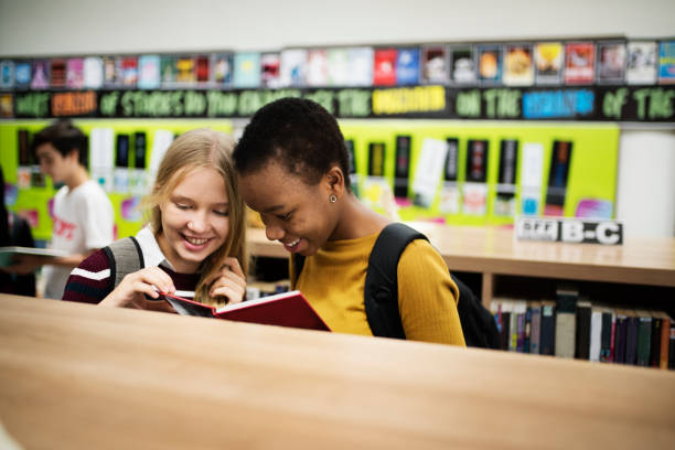 Diverse group of high school students in library