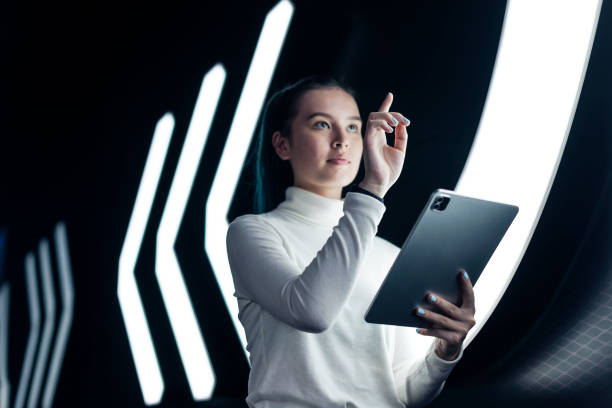 istock Asian girl pressing on digital screen futuristic technology 2158051050