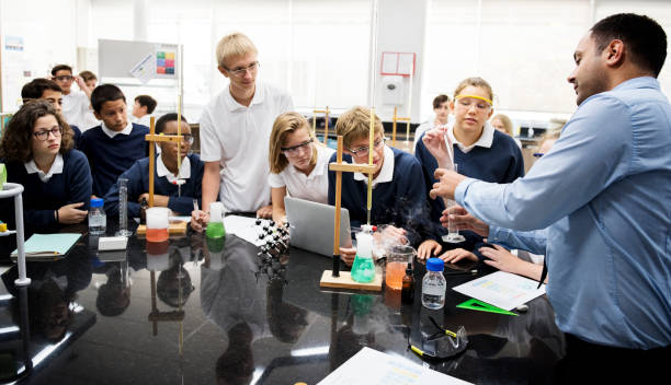 istock A group of student listening about a science experiment 2158051060