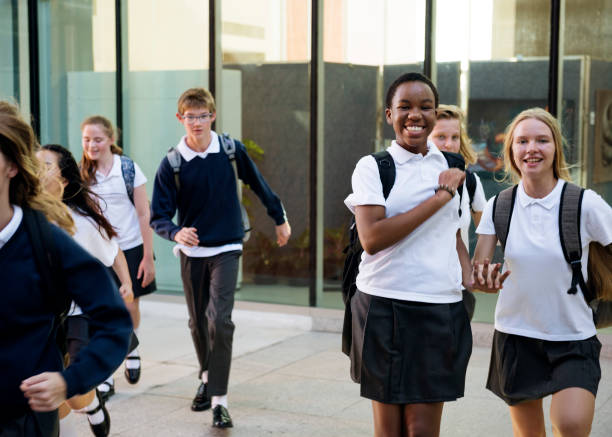 istock Group of students walking in the school 2158051135