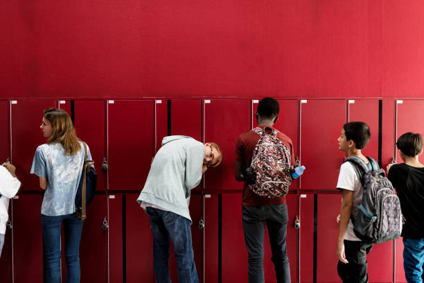 istock Students friends at lockers room 2158051148
