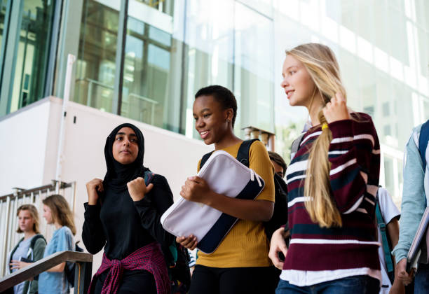 istock Group of students walking in the school 2158051170