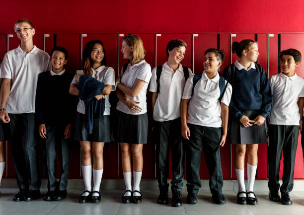 istock Friends standing together in front of lockers 2158051186