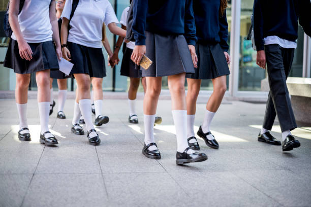 istock Group of girl students walking at school 2158051196