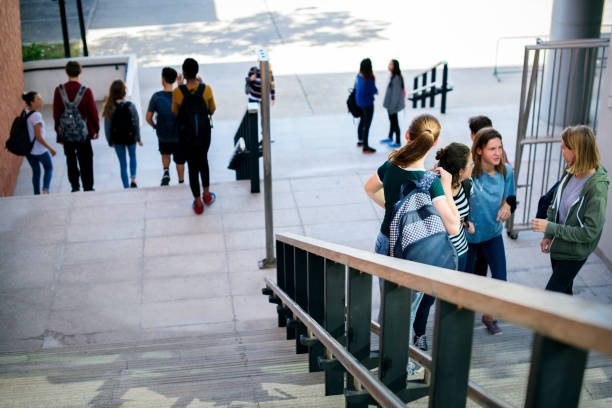 istock Group of students walking up and down the stairs 2158051246