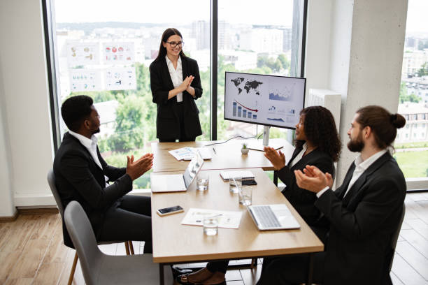istock Business presentation with diverse team applauding in modern office 2158051264