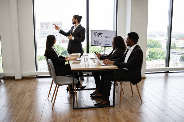 istock Business presentation with multiracial team in modern office 2158051266