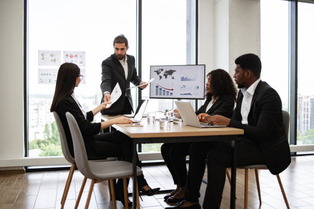 istock Business meeting with team discussing charts and documents 2158051299