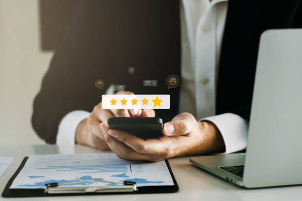 istock Customer service. Best rating experience satisfaction survey concept. man using smartphone Give a rating of satisfaction on after-sales service. 2158051574