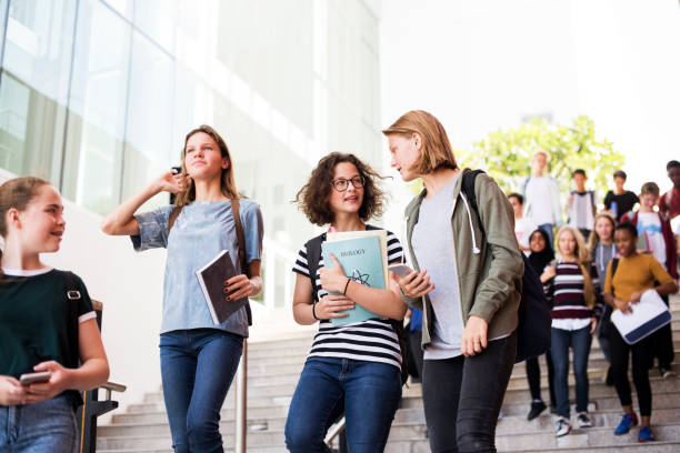istock Group of students walking in the school 2158051746