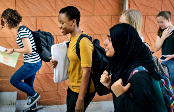istock Group of students walking in the school 2158052120