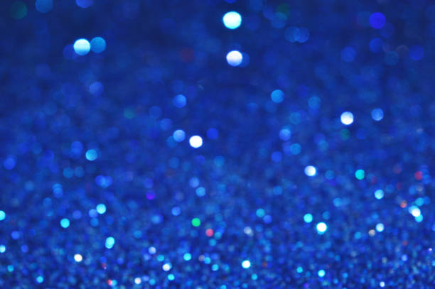 Blue Festive sparkling sequins background with Fairy Christmas Lights
