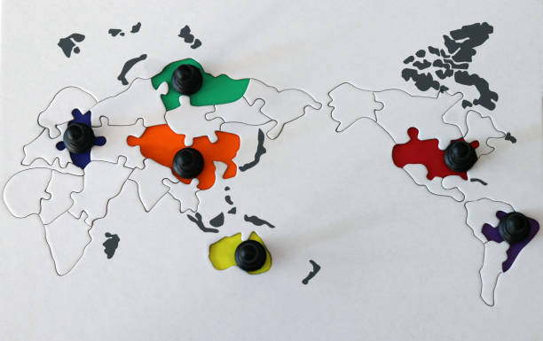istock Black pawns is standing on the world map. 2158055142