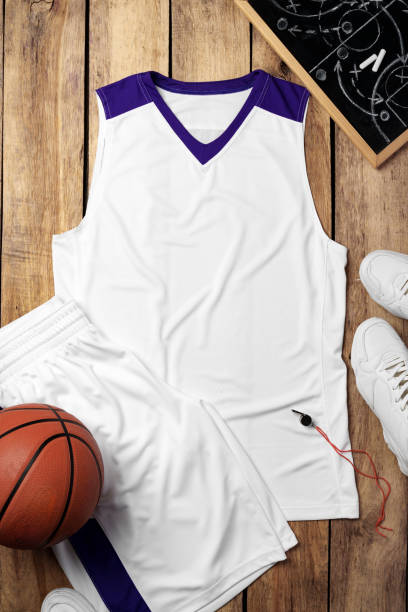 istock Basketball uniform on wooden background top view 2158056576