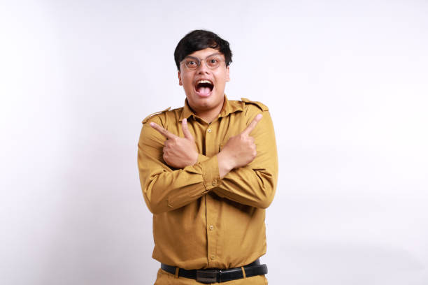 istock Happy Indonesian government employees standing while presenting both sides. Isolated on white 2158056794
