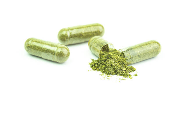 istock Andrographis Paniculata powder herbal capsules isolated 2158057486