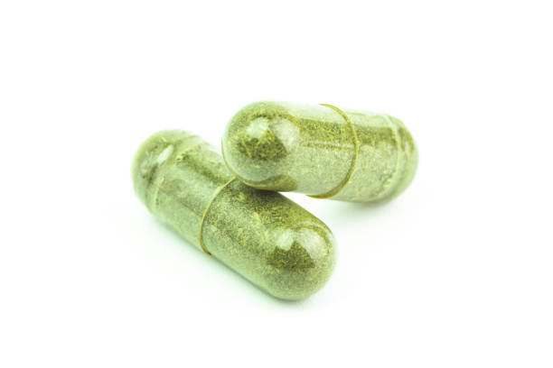 istock Andrographis Paniculata powder herbal capsules isolated 2158057514