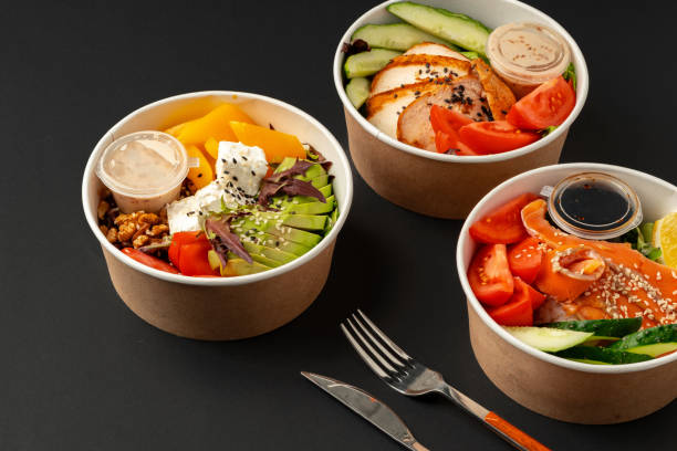 istock Side view of fresh poke bowls on black background 2158057556
