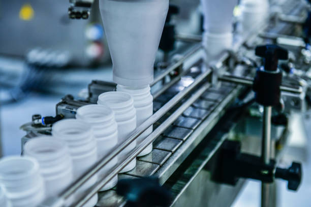 istock High speed counting and automatic tablet bottling machine in the pharmaceutical industry production line 2158058955