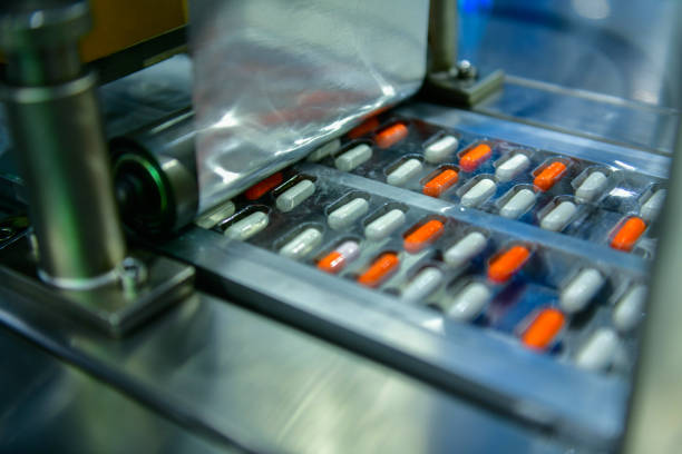 istock Capsule medicine pills during production line and packing process on modern pharmaceutical factory 2158059043