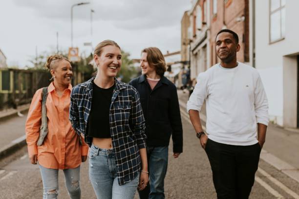 istock Cheerful diverse friends walking in the city 2158060667