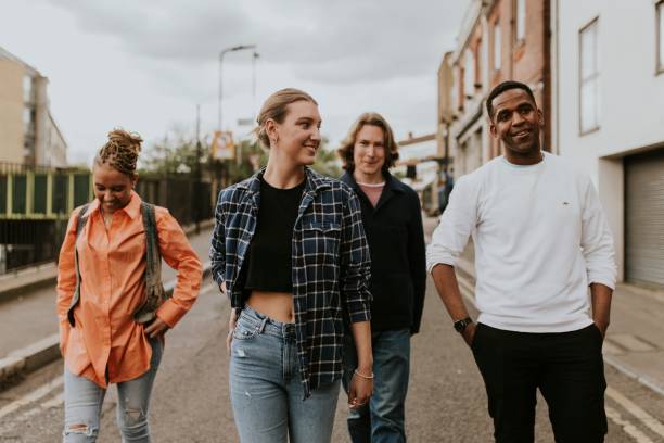 istock Cheerful diverse friends walking in the city 2158060675