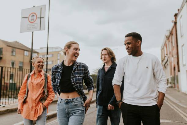 istock Cheerful diverse friends walking in the city 2158060678