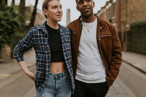 istock Diverse couple on a date, walking in the city 2158060710