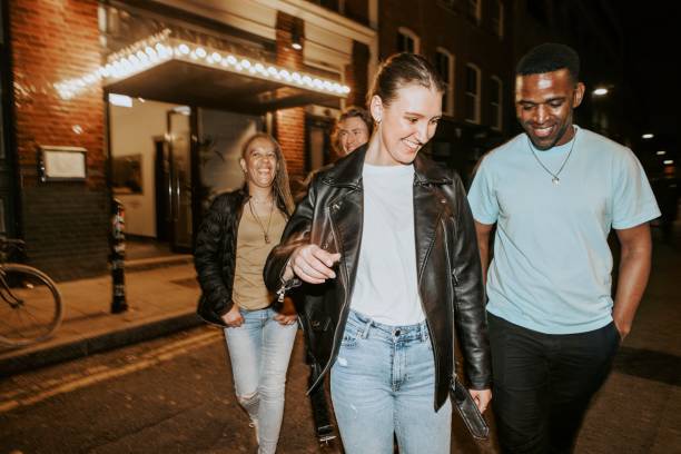 Diverse friends going out at night