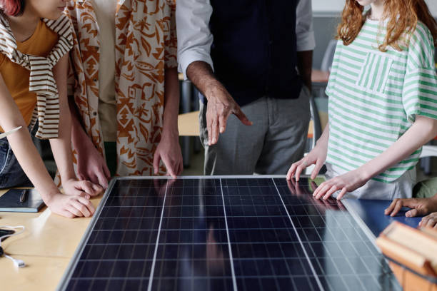 istock Teacher Showing Solar Panel To Kids 2158061288