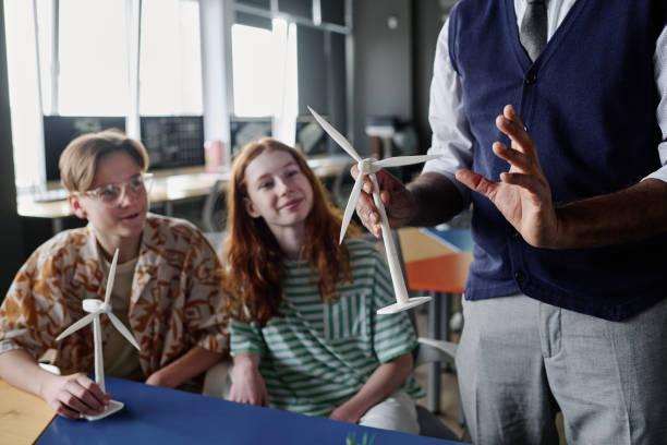 istock Unrecognizable Teacher Showing Wind Turbine Model 2158061509