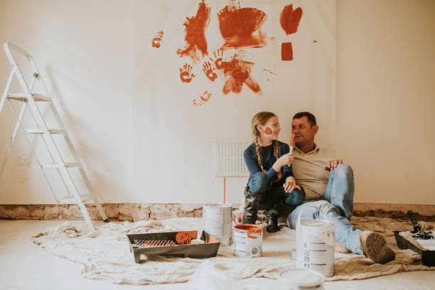 istock Home painting daughter and father 2158061808