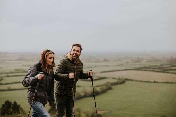 istock Couple trekking on mountain together 2158061932