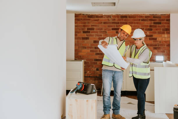 istock Woman and man contractor working together 2158061943