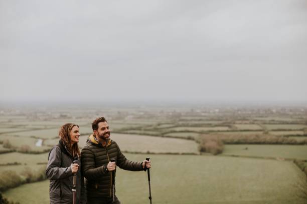 istock Couple trekking on mountain together 2158061950