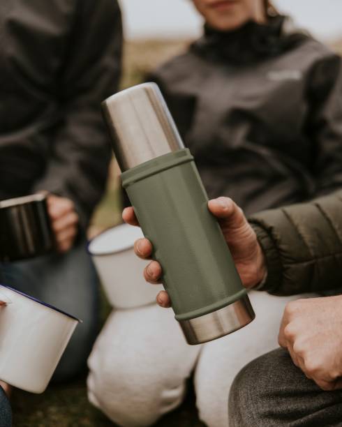 istock Green thermal bottle for camping & hiking 2158062211