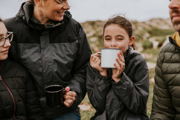 istock Camping family having morning drinks 2158062242