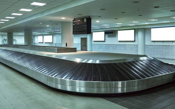 istock Baggage claim at luggage line. An empty luggage conveyor belt with the rubber sections. 2158062389