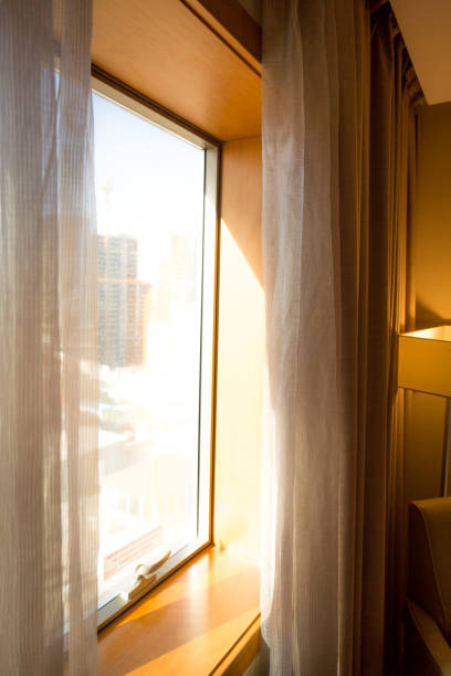 istock Hotel room window at sunset 2158062570
