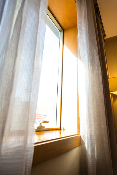 istock Hotel room window at sunset 2158062573