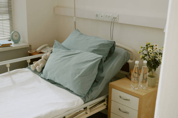 istock Single Bed With Linen in Hospital Ward 2158063629
