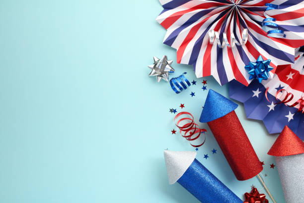 istock Happy Independence Day banner design featuring fireworks, paper fans, confetti on blue background. Suitable for 4th of July celebrations, Labor Day, election campaign 2158064236