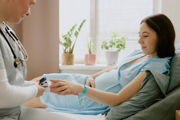istock Doctor Holding Womans Hand and Examining Saturation 2158064284
