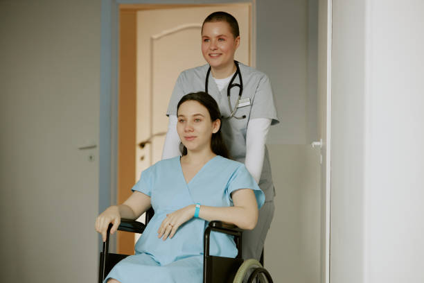 istock Nurse Taking Her Patient to Consulting Room 2158065655
